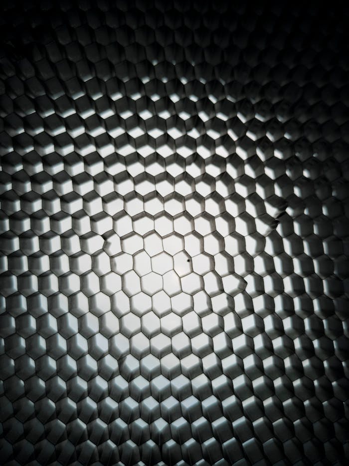 services-02 Dynamic geometric honeycomb pattern with metallic texture and gradient lighting.