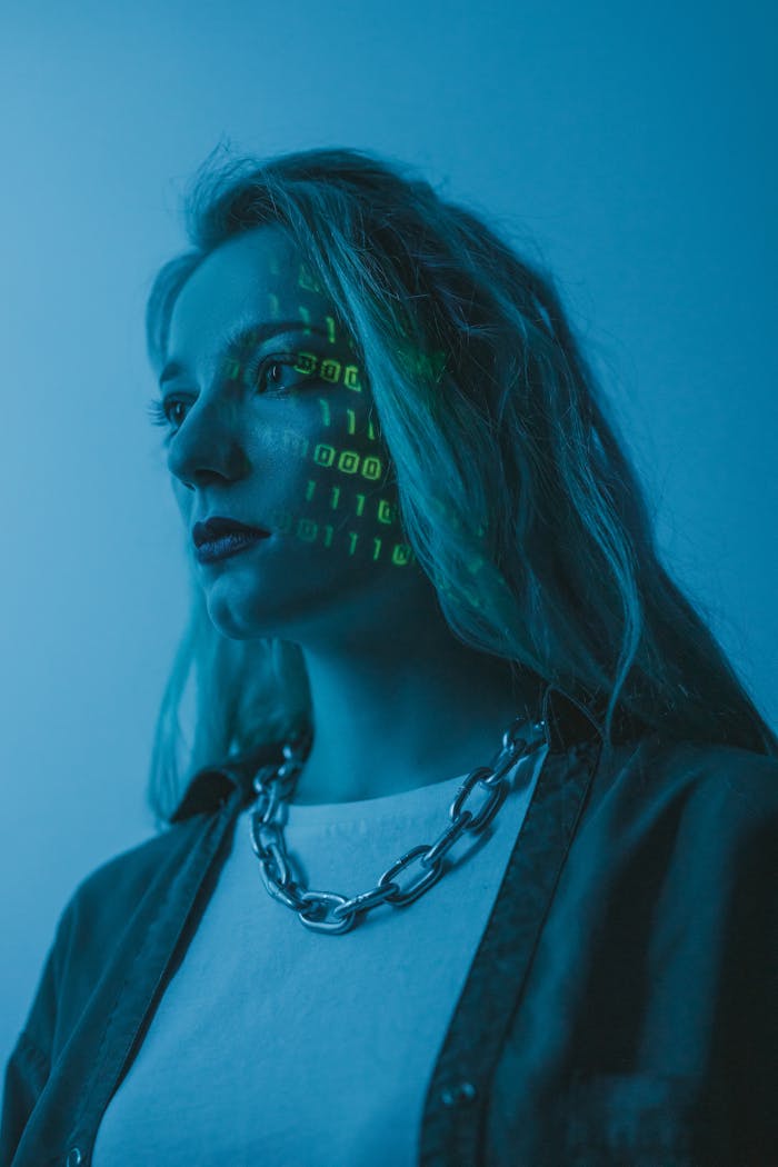Woman with illuminated binary code on her face, artistic tech concept.