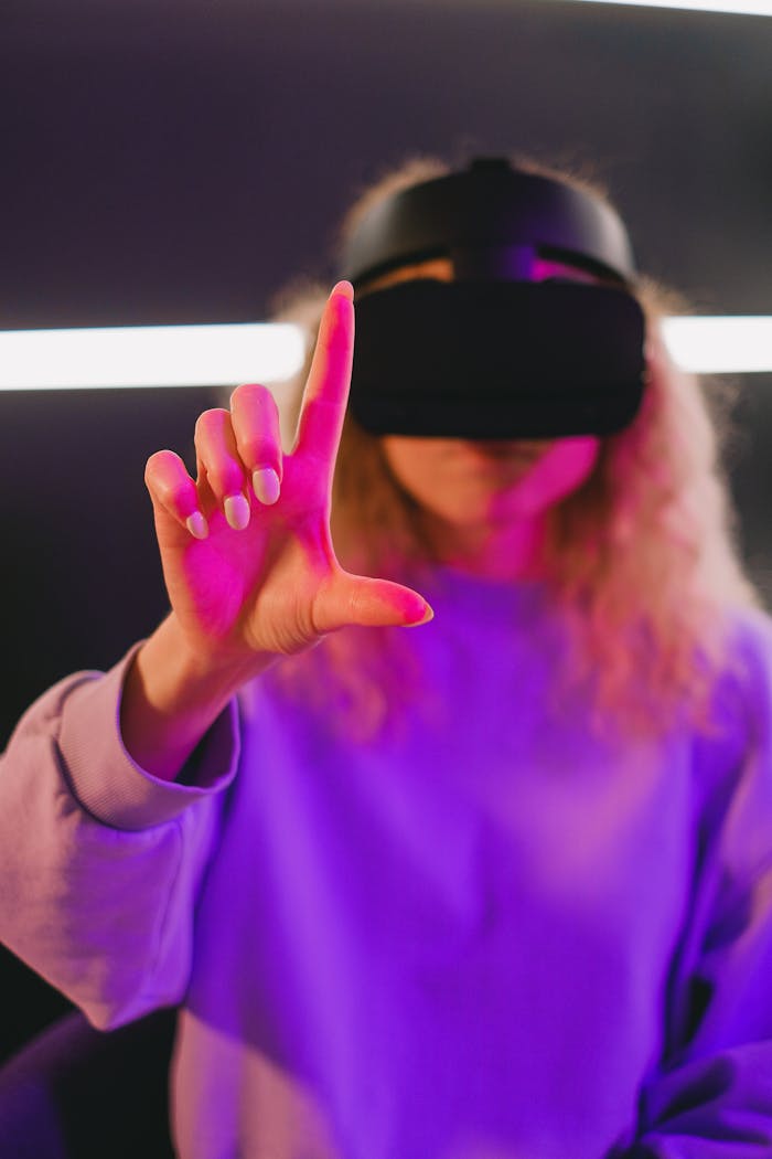 Woman using virtual reality headset and interacting with digital interface indoors.